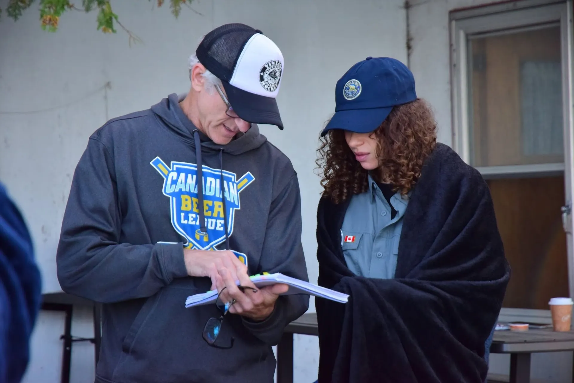 Two Lake Patrol team members reviewing pages together